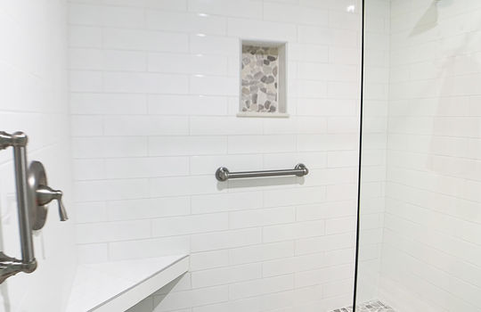 Master Shower with Grab Bars and Seat
