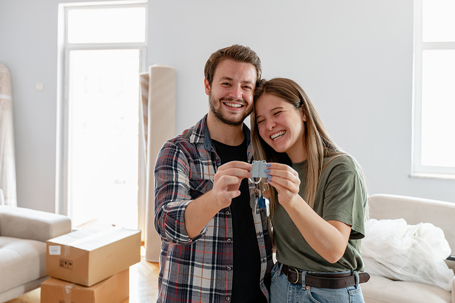 holding keys of their new home