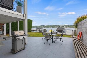 Back patio, grill and view of Lake Washington from the Matthews Beach home