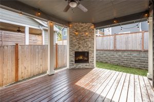 Covered porch with fireplace