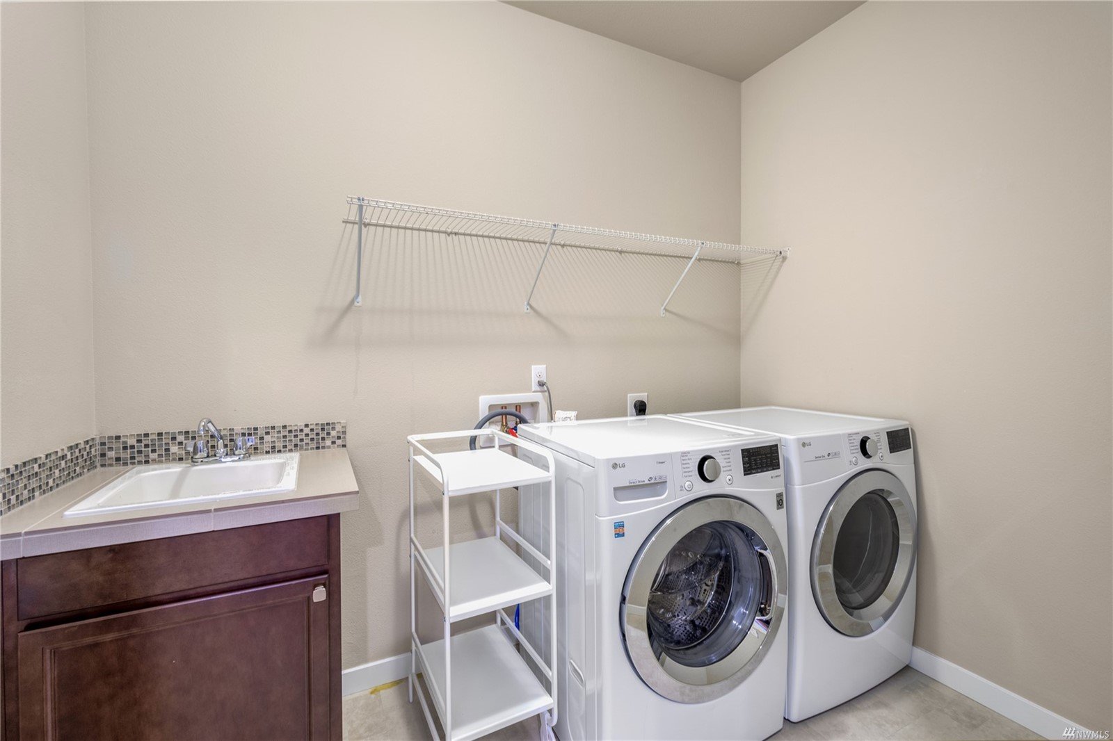 Utility room with modern washer and dryer