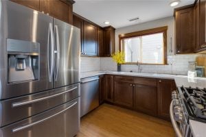 Kitchen with stainless steel refrigerator at 8357 10th Ave NW, Seattle