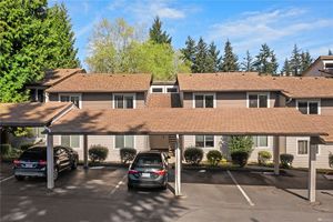 View of the buildings and parking lot at the Falcon Ridge Kirkland Condominiums