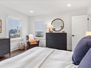 Another bedroom with a Space Needle view in the Colonial Home at 503 W Prospect St, Seattle, WA 98119