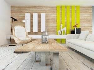 Rustic decor in a modern living room with a wood wall with yellow accents, contemporary wooden coffee table, white painted floorboards and a comfortable white sofa