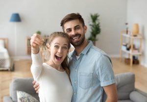 couple celebrating home buying