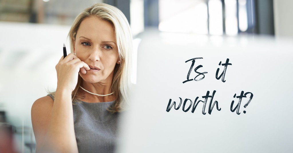 A woman wondering if buying a fixer upper is worth it