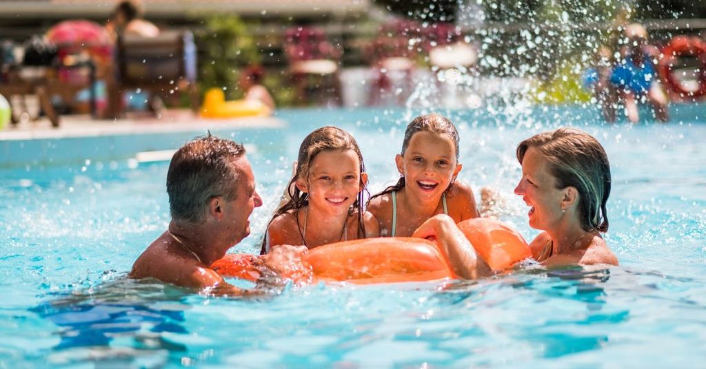 A happy family at their community pool, renting in Woodinville, WA