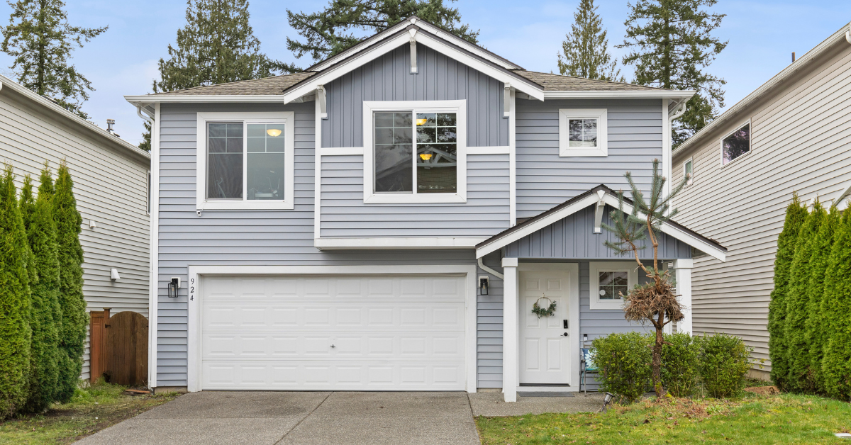 modern home in Kirkland, WA, emphasizing the appeal of the 11411 NE 124th St area, featuring lush greenery and stylish architecture to draw in Home Buyers.