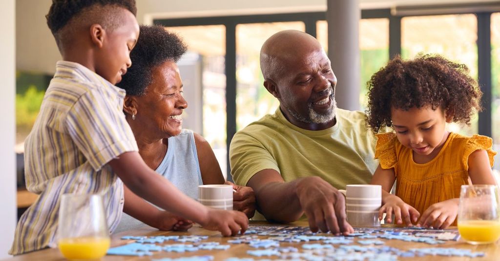 family doing a puzzle together at the holidays