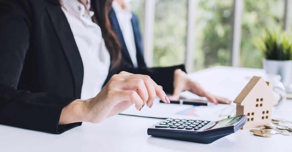 Buyer reviewing mortgage payment scenarios with a lender or advisor