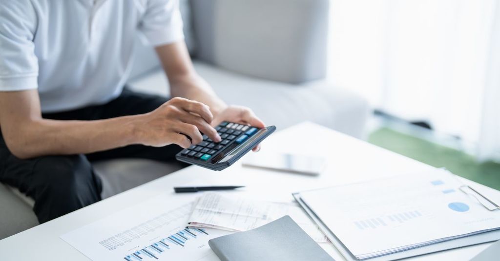 Close-up of calculator, mortgage worksheet, or financial planning discussion