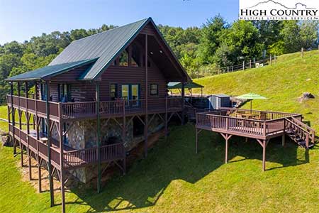 217 New River Landing exterior of log cabin home in Crumpler, NC
