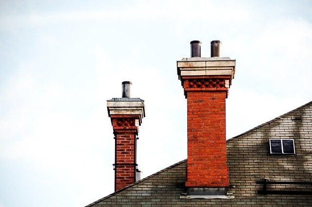 Chimney flumes on top of a home's roof