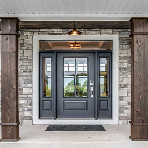 Gray front porch door with stone and dark columns