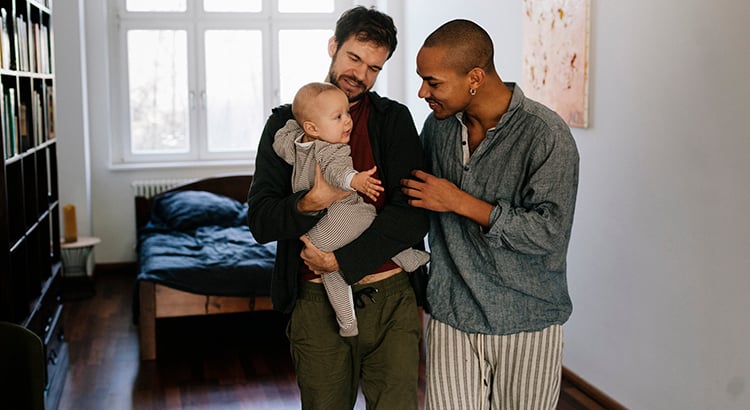 Gay Fathers leaving Bedroom with Son