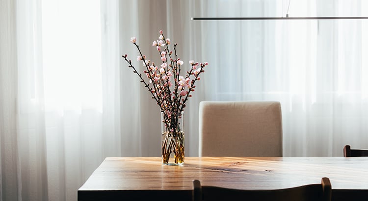 Almond Blossom Twigs in a Vase on Wooden Table in Living Room.