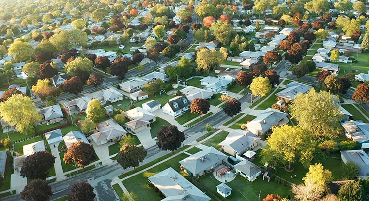 Aerial view of residential houses at autumn (october). American neighborhood, suburb. Real estate, drone shots, sunset, sunny morning, sunlight, from above