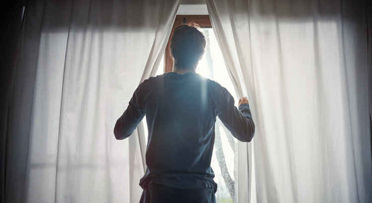 Man staring out the window