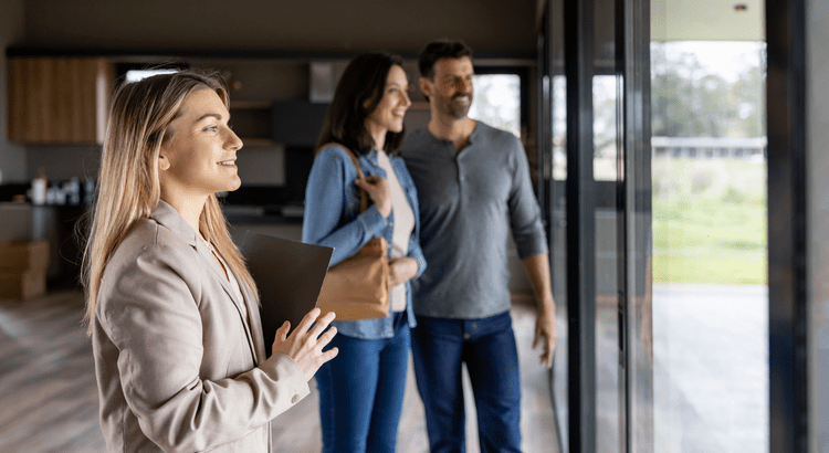 Agent with a couple touring a home.