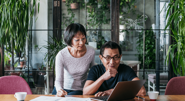 Couple looking at a laptop screen