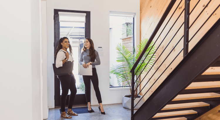 Agent and client touring a new construction home