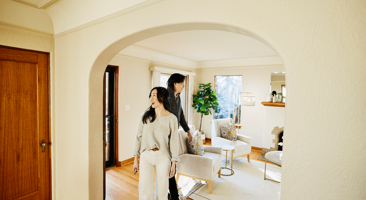 Couple touring a home with excitement