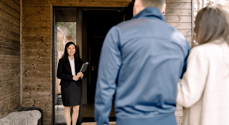 Homebuyers meeting their agent to tour a house for sale