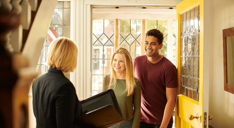 A couple touring homes with a top real estate agent.