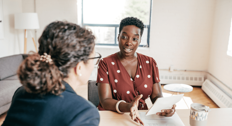 A Realtor having a buyer consultation with a homebuyer.