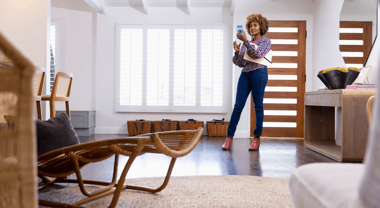 An home stager checking sightlines in the living room