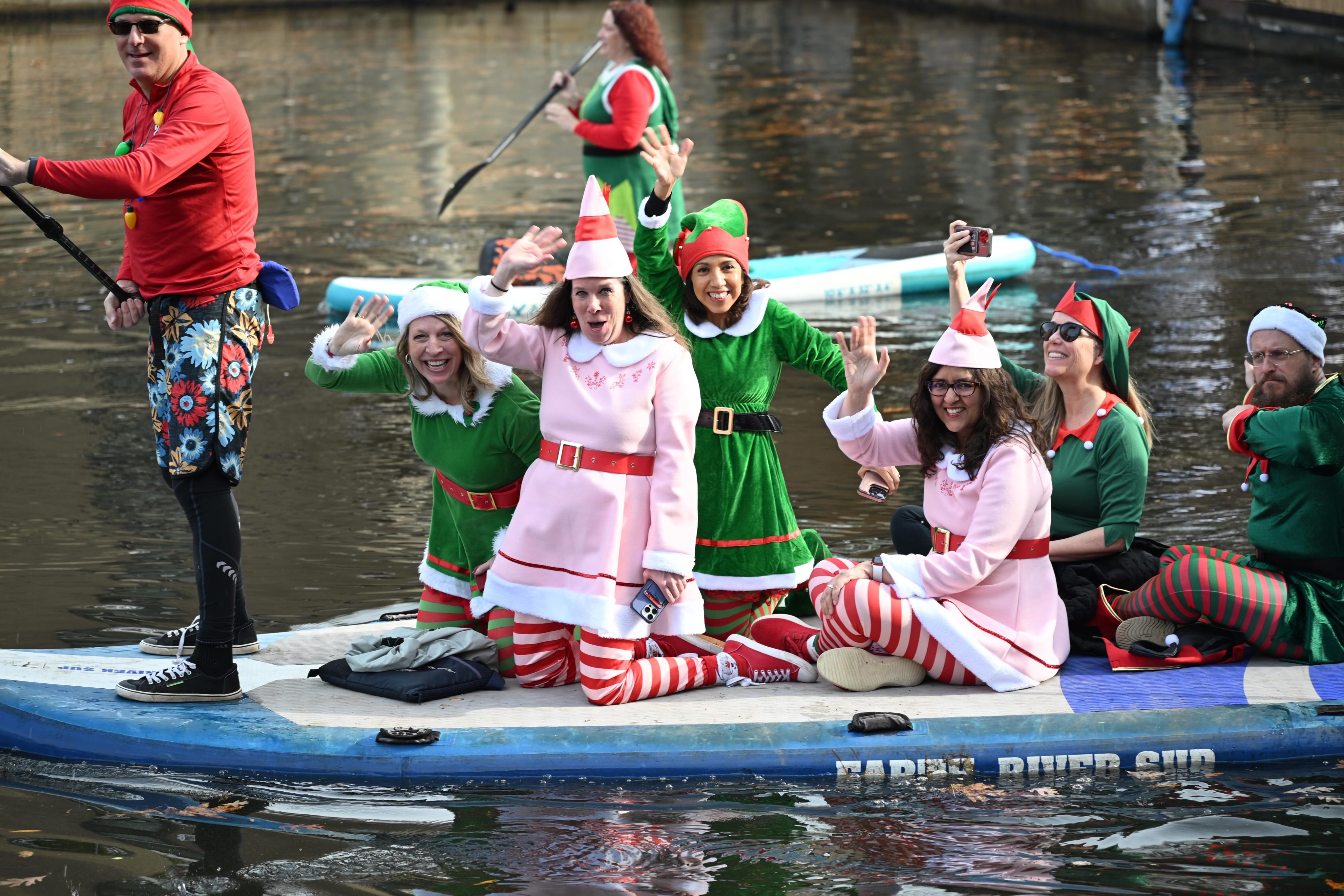 Elves on Paddle Boards at the Jingle on the Lake Event on Lake Anne in Reston, VA