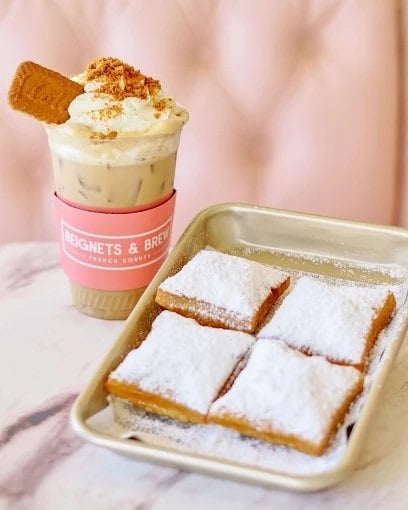 Powdered sugar beignets and an iced coffee at Beignets and Brew on Elden Street in Herndon