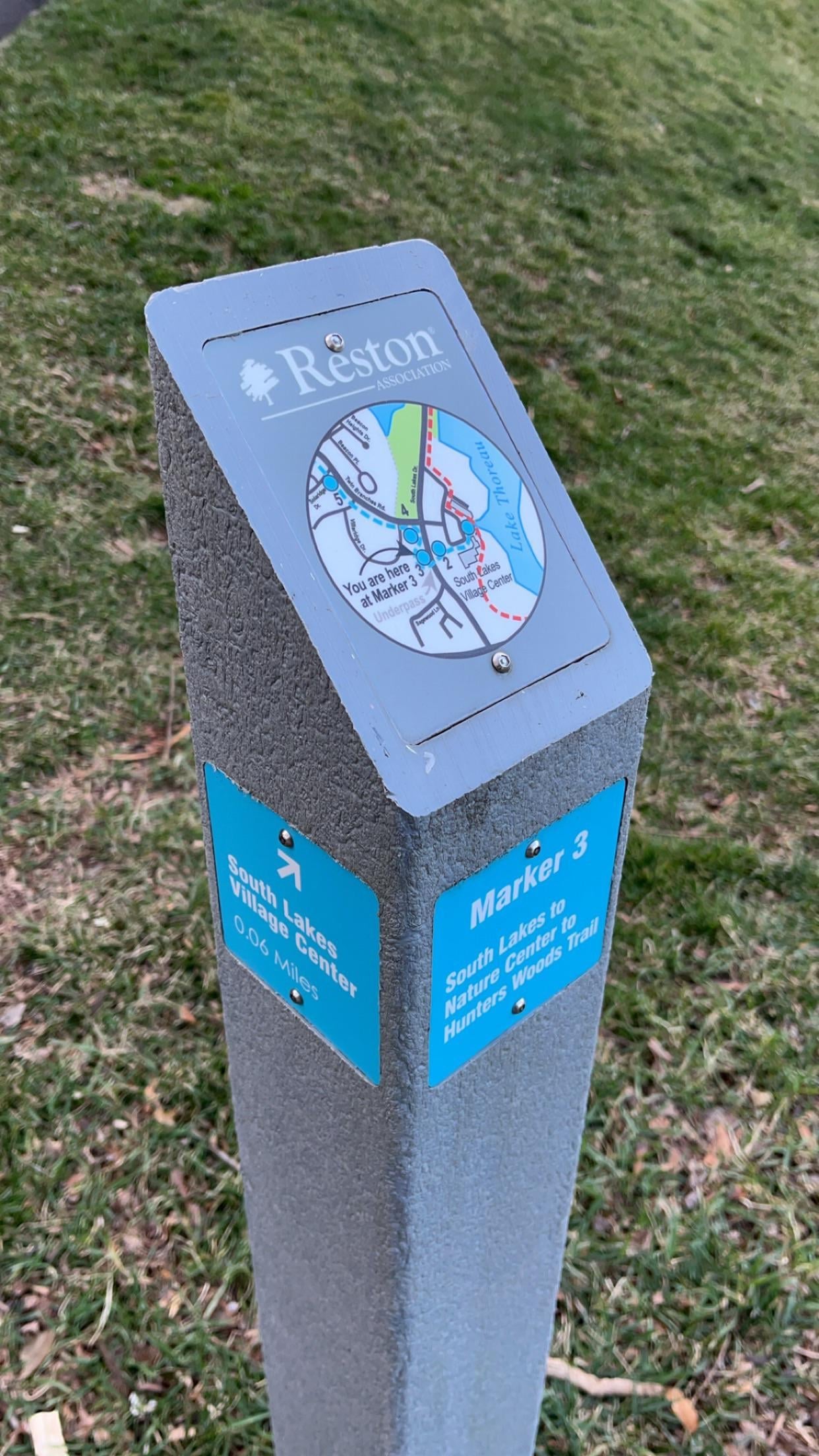 A Reston Association trail marker post showing Marker 3 on the South Lakes to Hunters Woods route