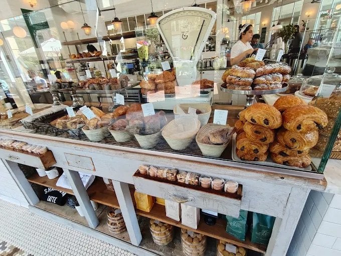 Pastry case with croissants and pastries at Tatte Bakery and Cafe in Reston Town Center