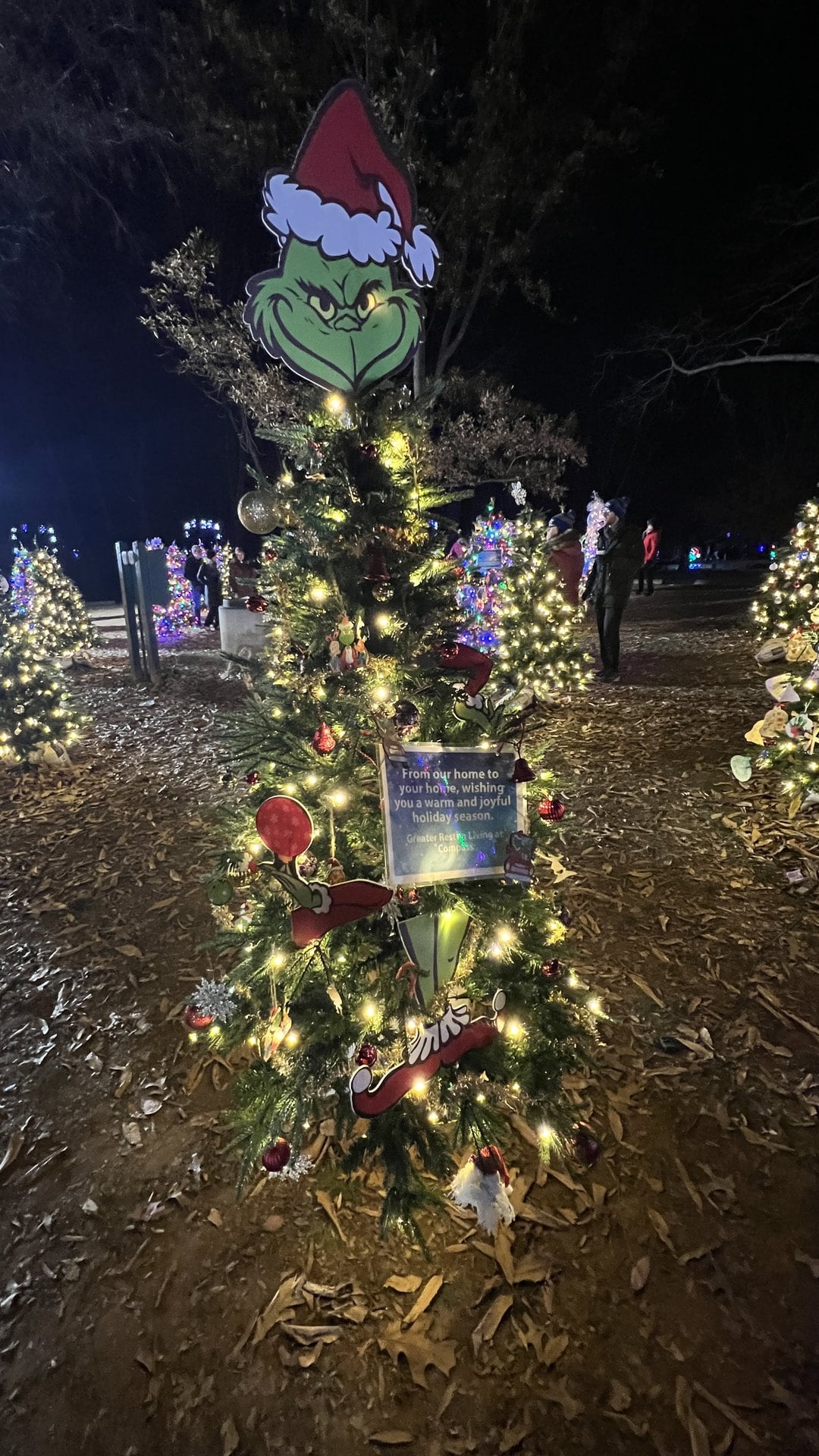 Grinch-topped Enchanted Forest tree decorated by Greater Reston Living at Winterfest in Reston, Virginia