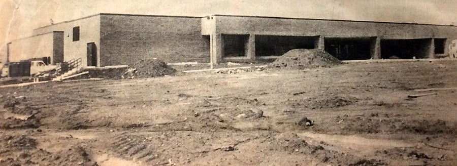 Black and white photo of Clearview Elementary School under construction in 1979, with dirt piles in front of the brick building