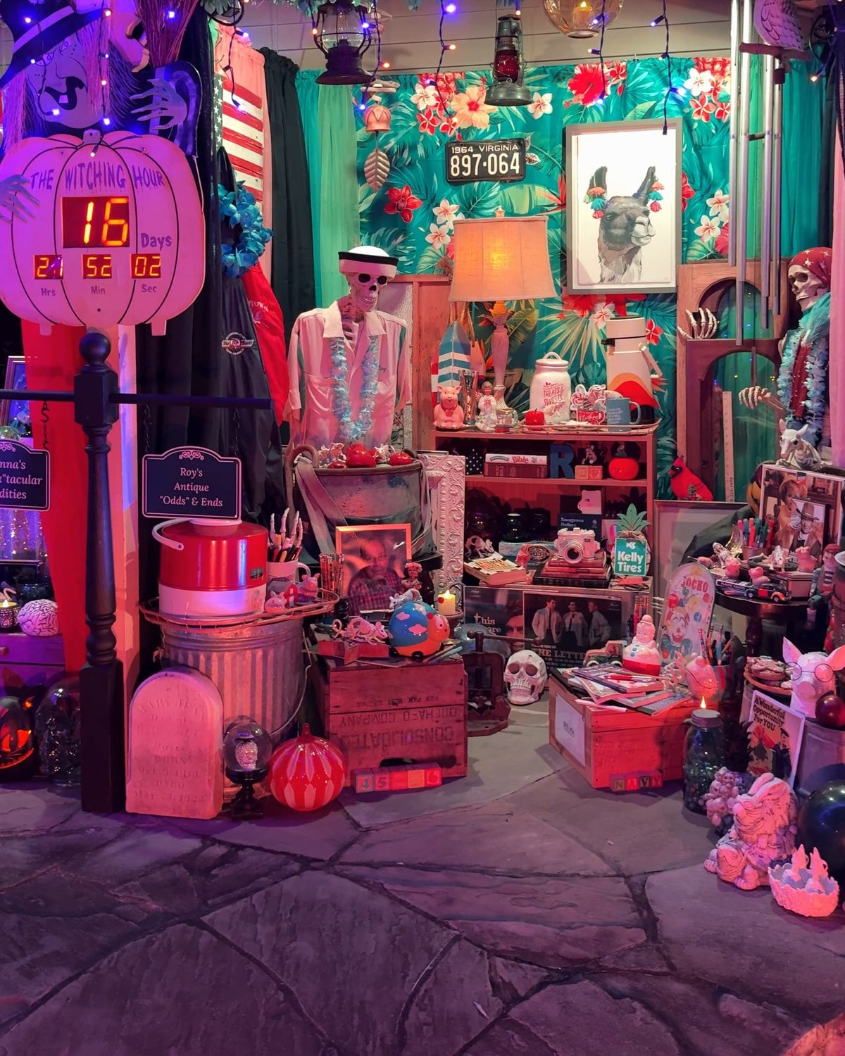 Roy's Antique Odds and Ends Shop scene at the Historic Herndon Halloween House, with collectibles, a skeleton shopkeeper and a Witching Hour countdown clock