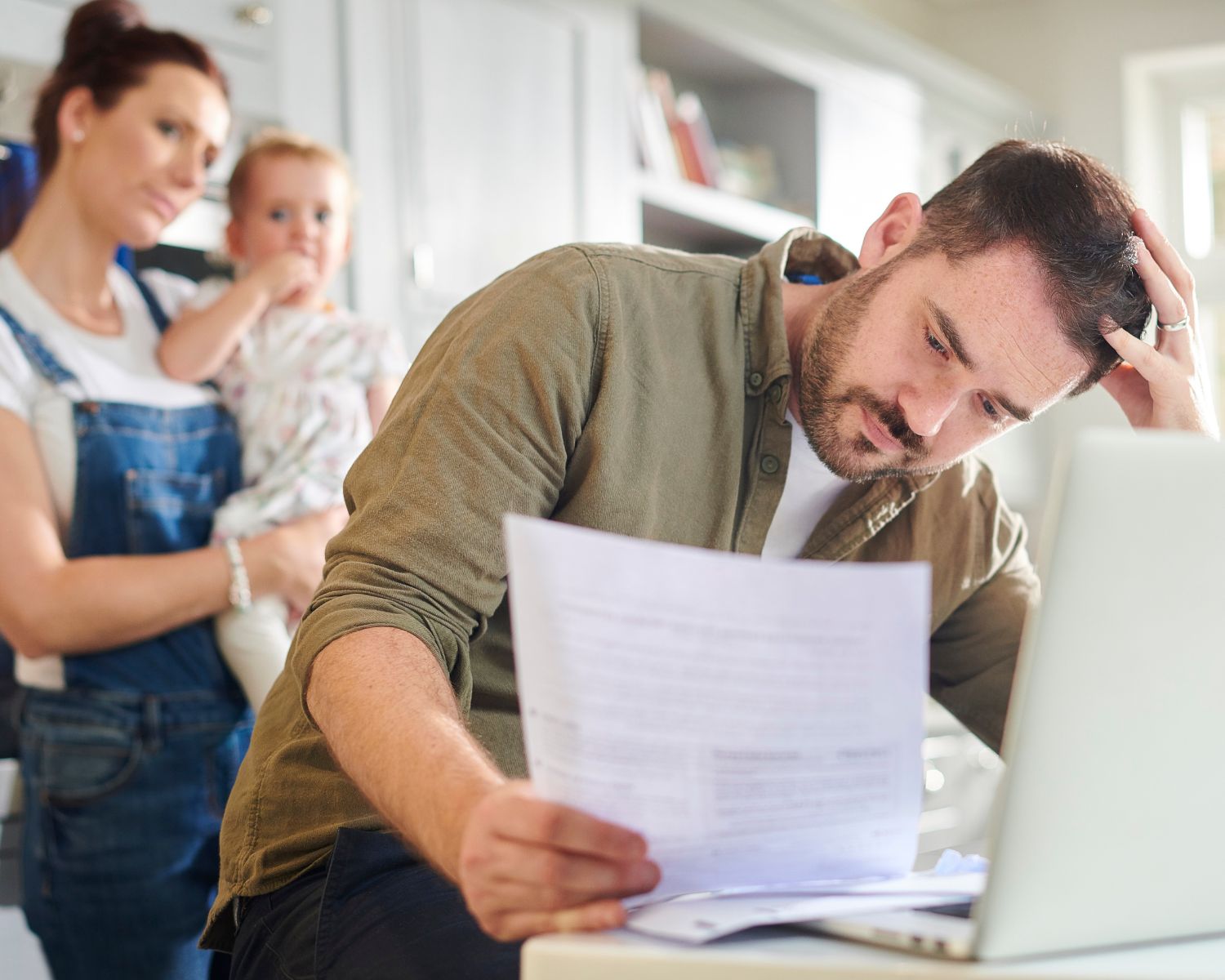 Home buyer examining a potential issue while touring a house.