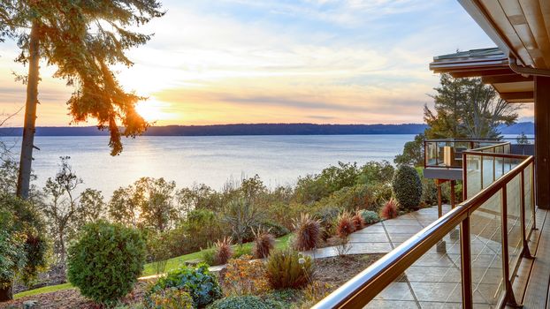 Modern two story panorama house with wraparound deck