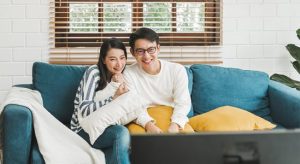 Young couple smiling in sofa