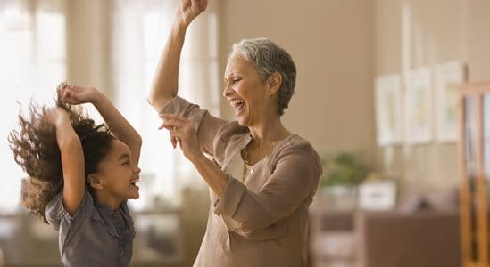 Senior woman dancing with her grand daughter