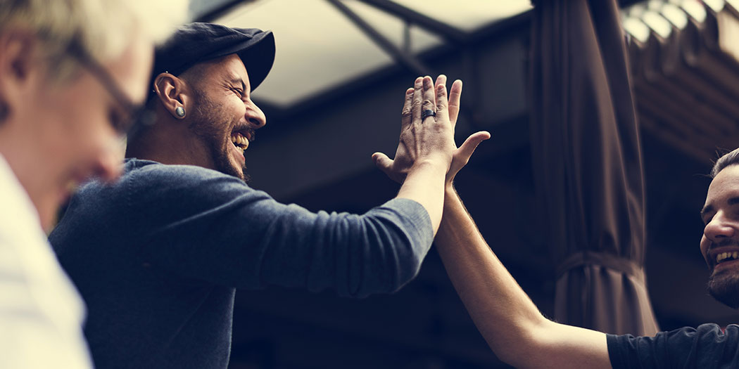 2 young man doing high five