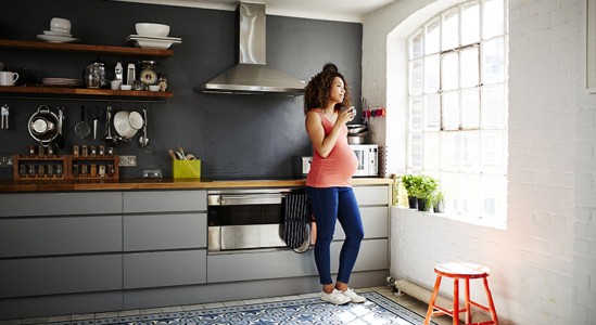 Pregnant woman in the kitchen