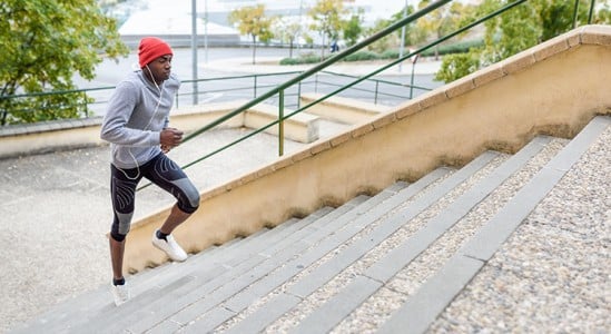 Man running to stairs doing exercise
