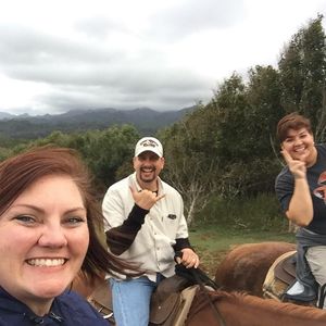 Richard, Brandy and a young man doing horse back rising