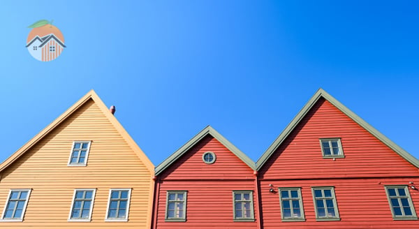 Row houses under a blue sky