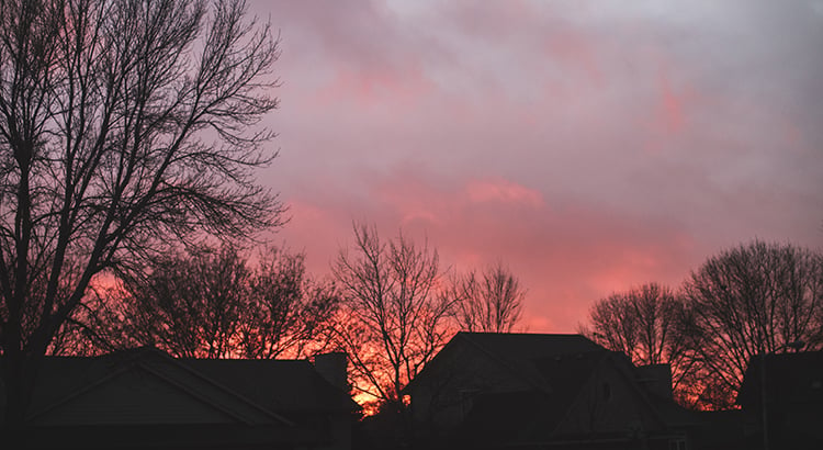 Vibrantly colored pink and purple sky as the sun sets