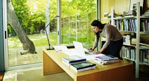 Woman working on laptop in home office
