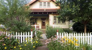 Bungalow House with White Picket Fence